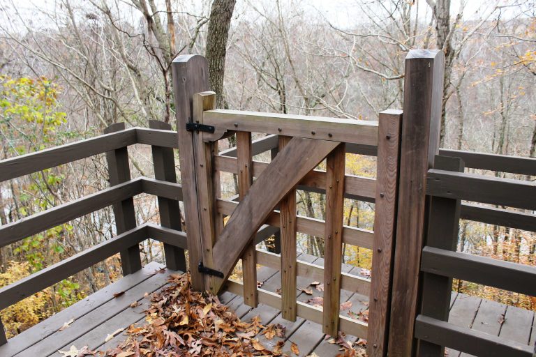 This handsome timber frame gate serves as an entry to an extra portion of deck overlooking this client's vast property.