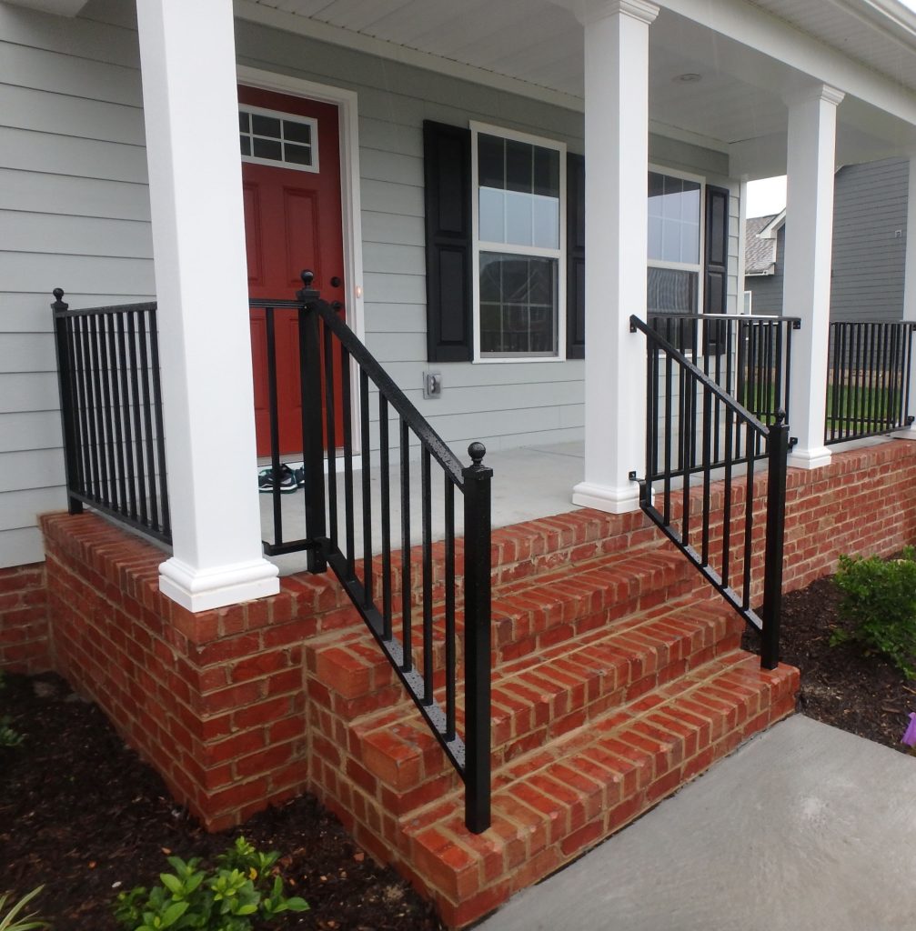 This is a 2" Wood-Look rail with ball caps and black powder coated finish.