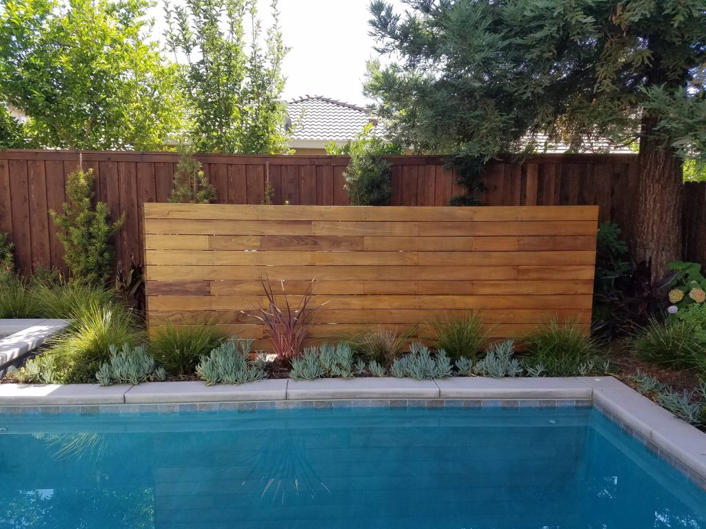 This is a clever way to hide equipment and other yard items. A second box was built on the other side of the yard.