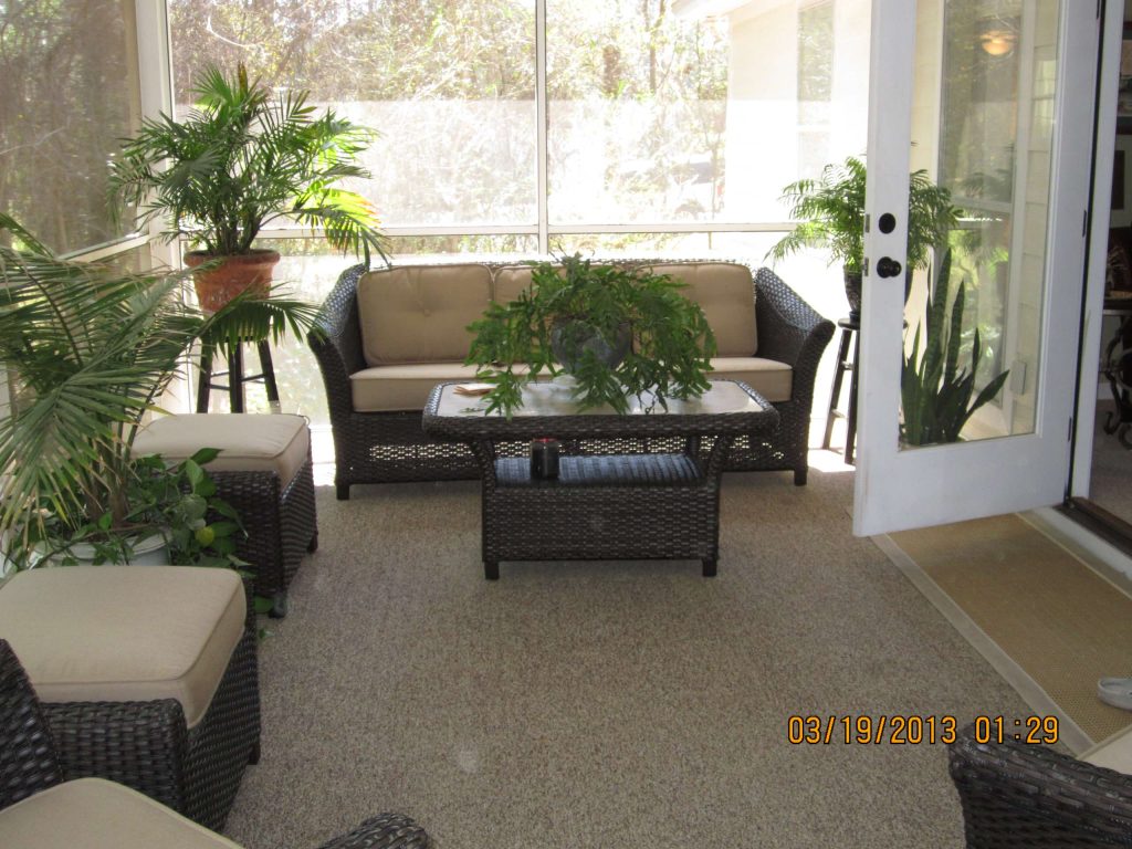 This is an elevated screened back porch that beckons you to have coffee, a cocktail or read a book. Enjoy.