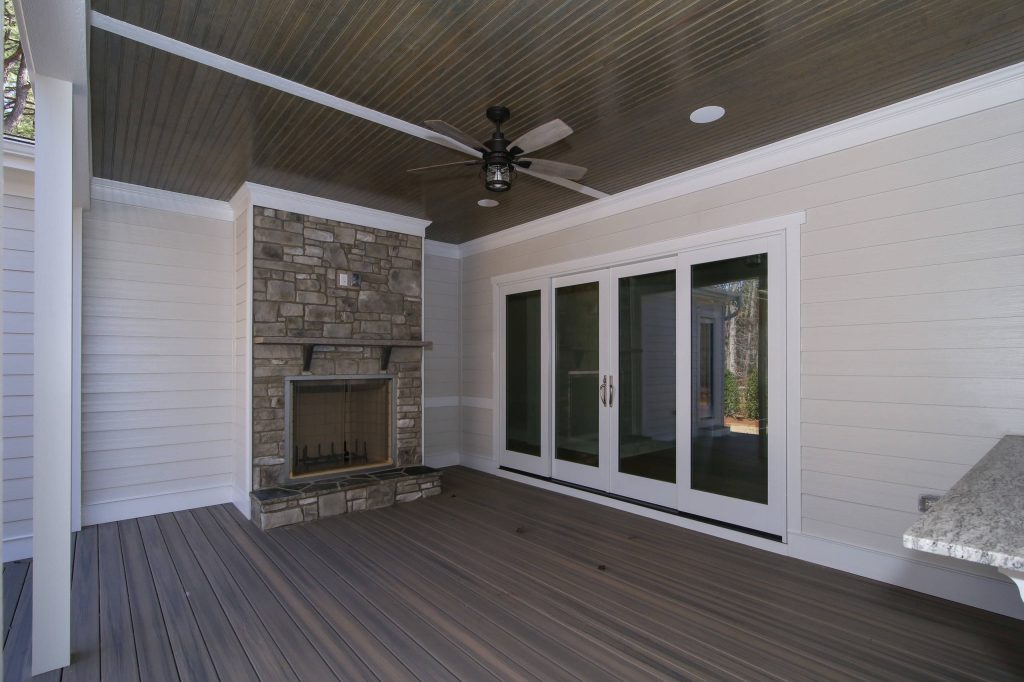 This is an example of a back porch design in Raleigh with a fire pit and a roof extension. by Colvard Farms Development Co | Outdoor Photos | Porch | Landscaping | Landscape Design | Outdoor Living Space | Porch Design Ideas | Outdoor Living Space Ideas | Backyard Design