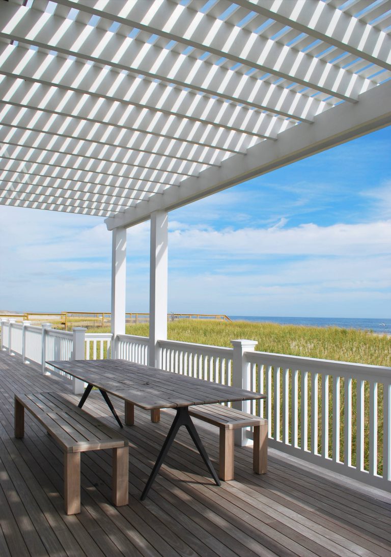 This is an example of a coastal back porch design in New York with decking and a pergola. by William Petrone | Outdoor Photos | Porch | Landscaping | Landscape Design | Outdoor Living Space | Porch Design Ideas | Outdoor Living Space Ideas | Backyard Design