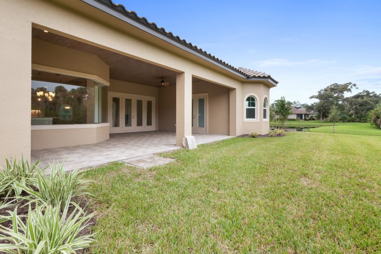 This is an example of a coastal outdoor kitchen porch design in Orlando.