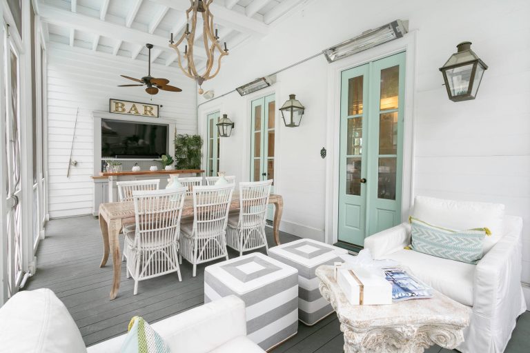 This is an example of a coastal porch design in Charleston with decking and a roof extension. by Charleston Home + Design Mag | Outdoor Photos | Porch | Landscaping | Landscape Design | Outdoor Living Space | Porch Design Ideas | Outdoor Living Space Ideas | Backyard Design