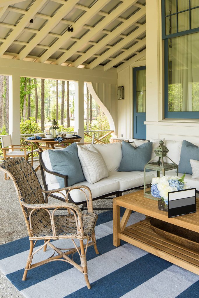 This is an example of a coastal porch design in Charlotte with a roof extension. by Pursley Dixon Architecture | Outdoor Photos | Porch | Landscaping | Landscape Design | Outdoor Living Space | Porch Design Ideas | Outdoor Living Space Ideas | Backyard Design