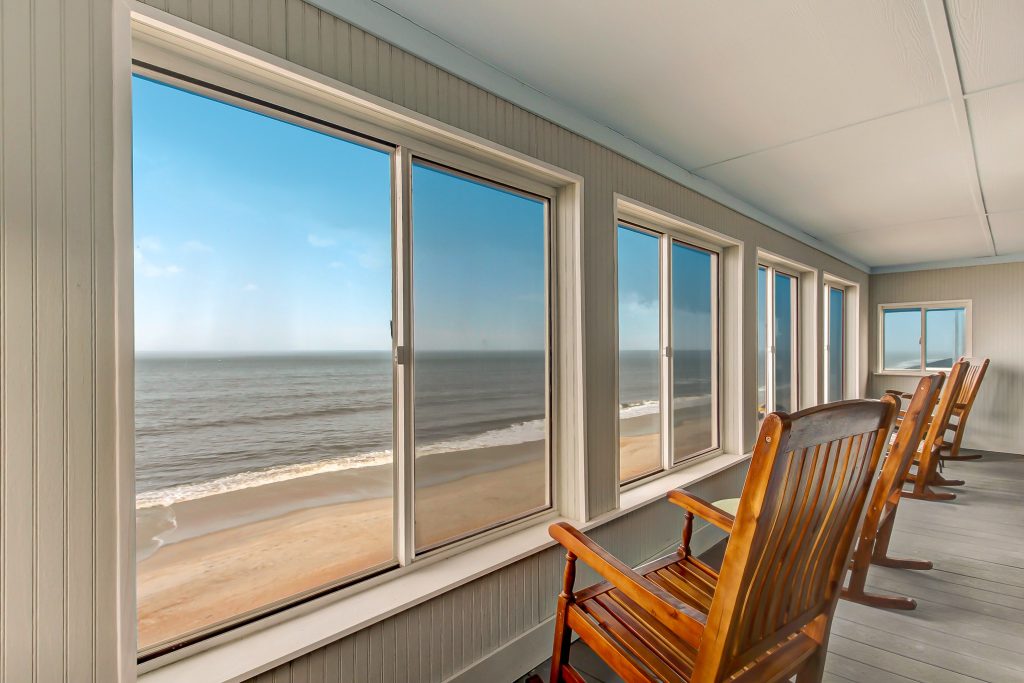 This is an example of a coastal porch design in Jacksonville. by SunCoast Beach Vacations | Outdoor Photos | Porch | Landscaping | Landscape Design | Outdoor Living Space | Porch Design Ideas | Outdoor Living Space Ideas | Backyard Design