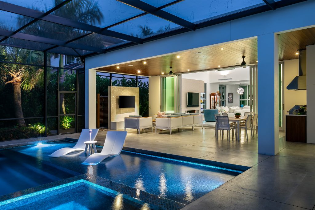 This is an example of a coastal porch design in Tampa. by David K. Lowe - Interior Design | Outdoor Photos | Porch | Landscaping | Landscape Design | Outdoor Living Space | Porch Design Ideas | Outdoor Living Space Ideas | Backyard Design