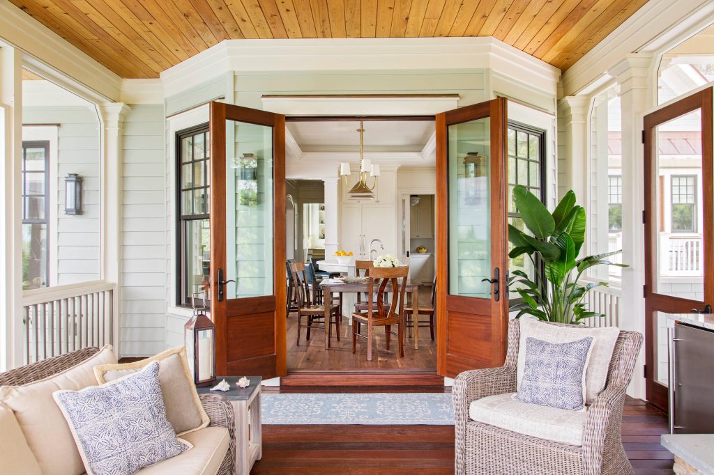 This is an example of a coastal screened-in porch design in Charleston with decking and a roof extension. by Margaret Donaldson Interiors | Outdoor Photos | Porch | Landscaping | Landscape Design | Outdoor Living Space | Porch Design Ideas | Outdoor Living Space Ideas | Backyard Design