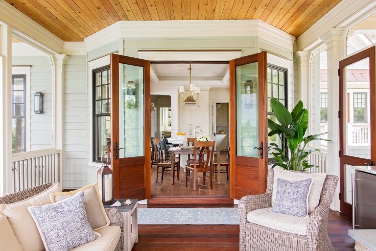 This is an example of a coastal screened-in porch design in Charleston with decking and a roof extension. by Margaret Donaldson Interiors | Outdoor Photos | Porch | Landscaping | Landscape Design | Outdoor Living Space | Porch Design Ideas | Outdoor Living Space Ideas | Backyard Design