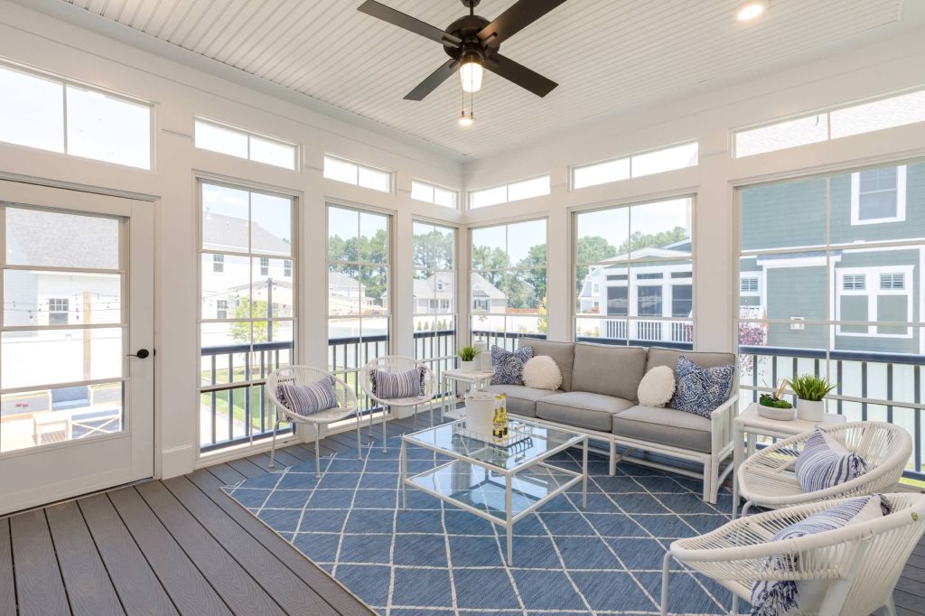This is an example of a coastal screened-in porch design in Other with decking and a roof extension. by Stephen Alexander Homes & Neighborhoods | Outdoor Photos | Porch | Landscaping | Landscape Design | Outdoor Living Space | Porch Design Ideas | Outdoor Living Space Ideas | Backyard Design
