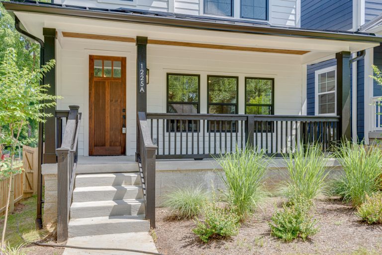 This is an example of a concrete porch design in Nashville with a roof extension. by Legacy South | Outdoor Photos | Porch | Landscaping | Landscape Design | Outdoor Living Space | Porch Design Ideas | Outdoor Living Space Ideas | Backyard Design