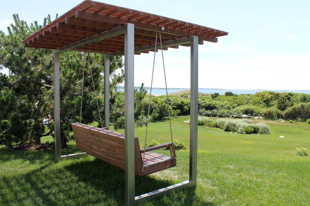This is an example of a contemporary backyard landscaping in Boston with a pergola.