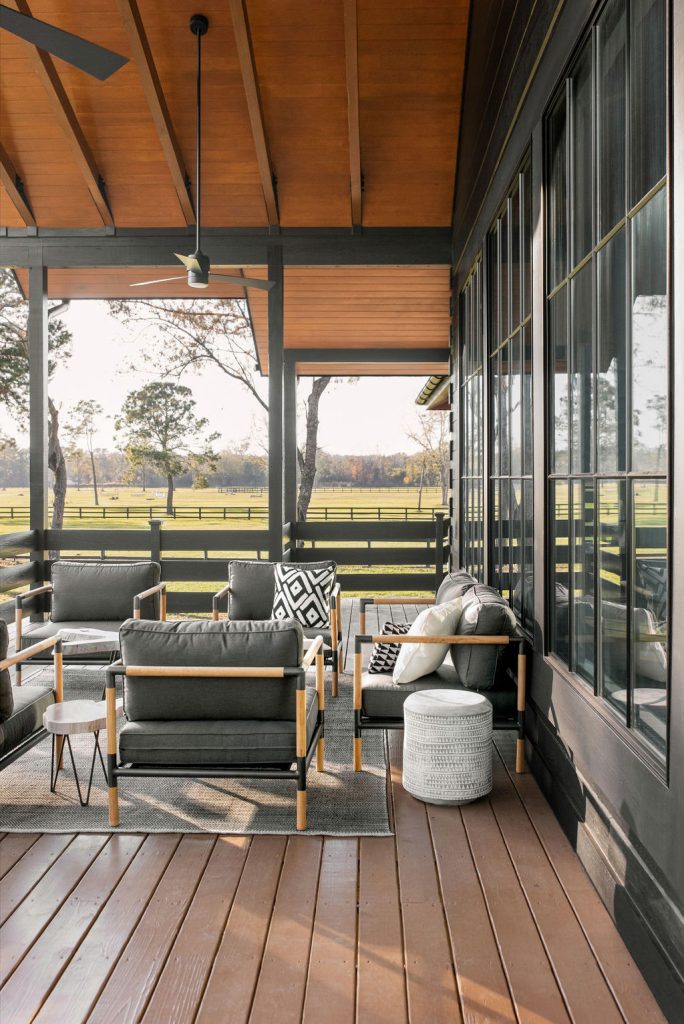 This is an example of a country back porch design in Charleston with decking and a roof extension. by Anne Architecture | Outdoor Photos | Porch | Landscaping | Landscape Design | Outdoor Living Space | Porch Design Ideas | Outdoor Living Space Ideas | Backyard Design