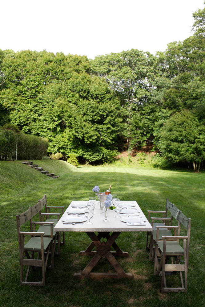 This is an example of a farmhouse backyard landscaping in New York.