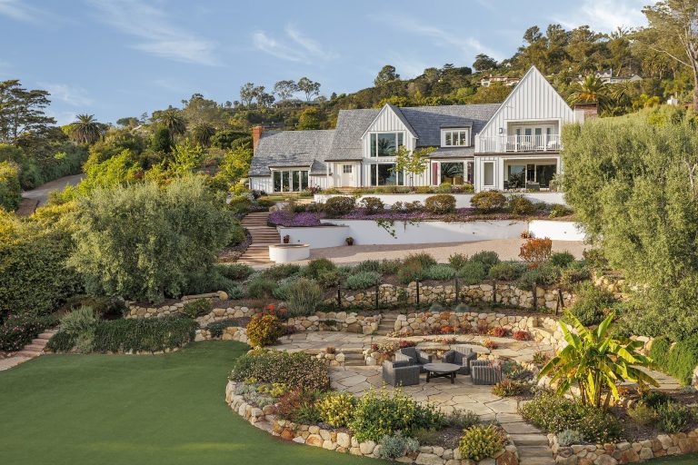 This is an example of a farmhouse full sun backyard stone formal garden in Santa Barbara.