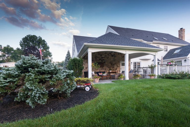 This is an example of a huge contemporary stone back porch design in Philadelphia with a roof extension. by Chestnut Hill Landscape Contractors | Outdoor Photos | Porch | Landscaping | Landscape Design | Outdoor Living Space | Porch Design Ideas | Outdoor Living Space Ideas | Backyard Design