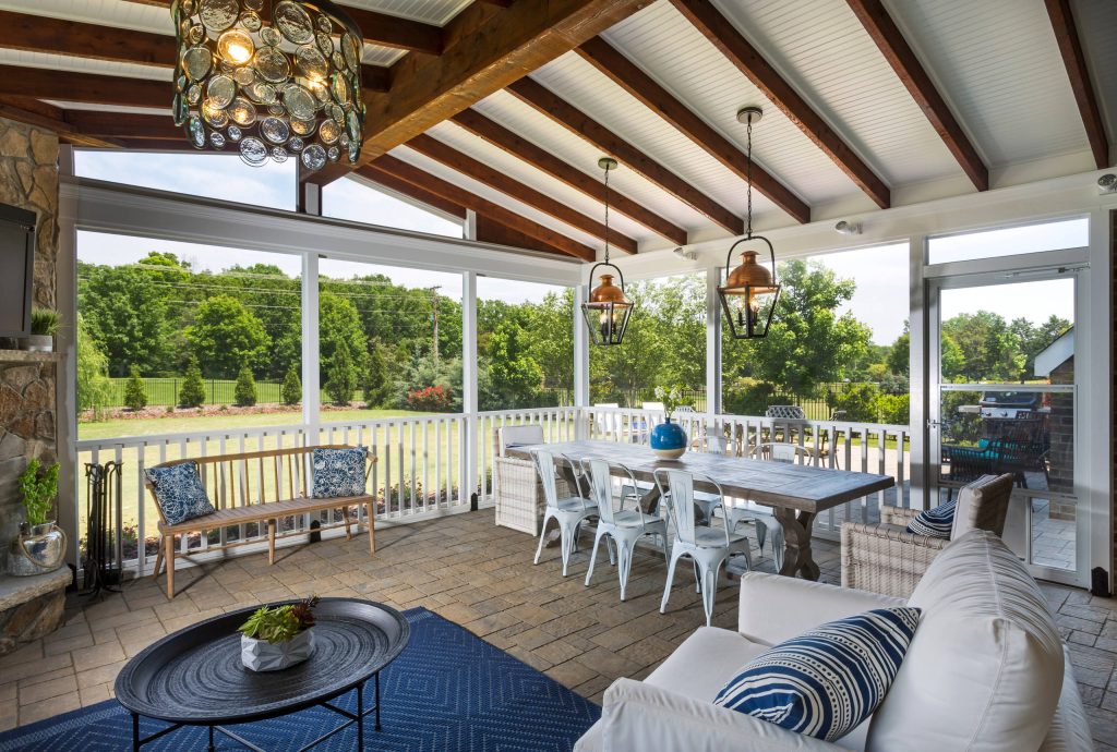 This is an example of a huge farmhouse concrete paver screened-in back porch design in Charlotte with a roof extension. by The Stone Man | Outdoor Photos | Porch | Landscaping | Landscape Design | Outdoor Living Space | Porch Design Ideas | Outdoor Living Space Ideas | Backyard Design