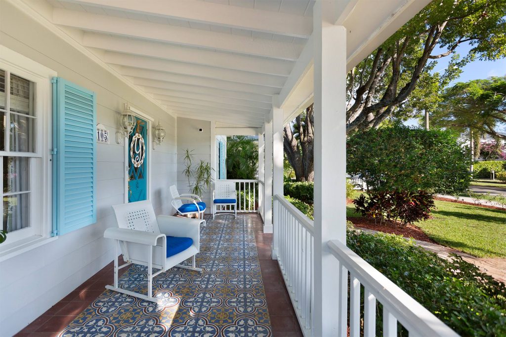 This is an example of a huge traditional tile front porch design in Miami with a roof extension. by Pascal Liguori & Son | Outdoor Photos | Porch | Landscaping | Landscape Design | Outdoor Living Space | Porch Design Ideas | Outdoor Living Space Ideas | Backyard Design