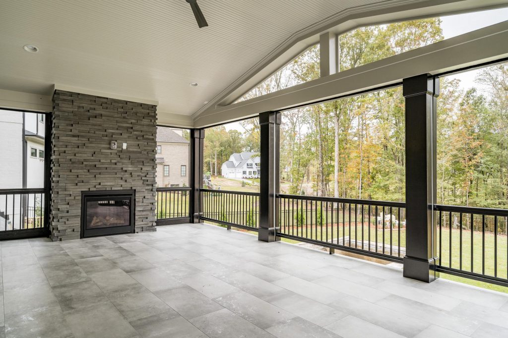 This is an example of a huge transitional back porch design in Raleigh with a fireplace and a roof extension. by Poythress Construction Company Inc. | Outdoor Photos | Porch | Landscaping | Landscape Design | Outdoor Living Space | Porch Design Ideas | Outdoor Living Space Ideas | Backyard Design