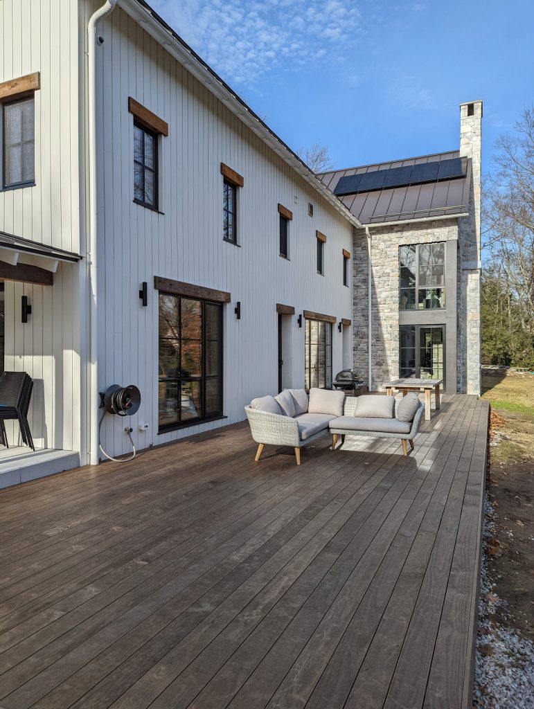 This is an example of a huge transitional wood railing back porch design in New York. by Trillium Architects | Outdoor Photos | Porch | Landscaping | Landscape Design | Outdoor Living Space | Porch Design Ideas | Outdoor Living Space Ideas | Backyard Design