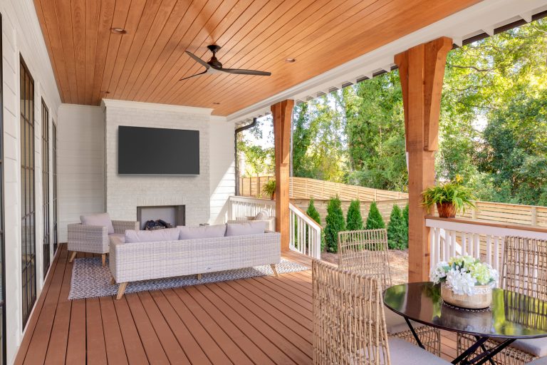 This is an example of a large coastal back porch design in Charlotte with a fireplace and a roof extension. by Pike Properties | Outdoor Photos | Porch | Landscaping | Landscape Design | Outdoor Living Space | Porch Design Ideas | Outdoor Living Space Ideas | Backyard Design