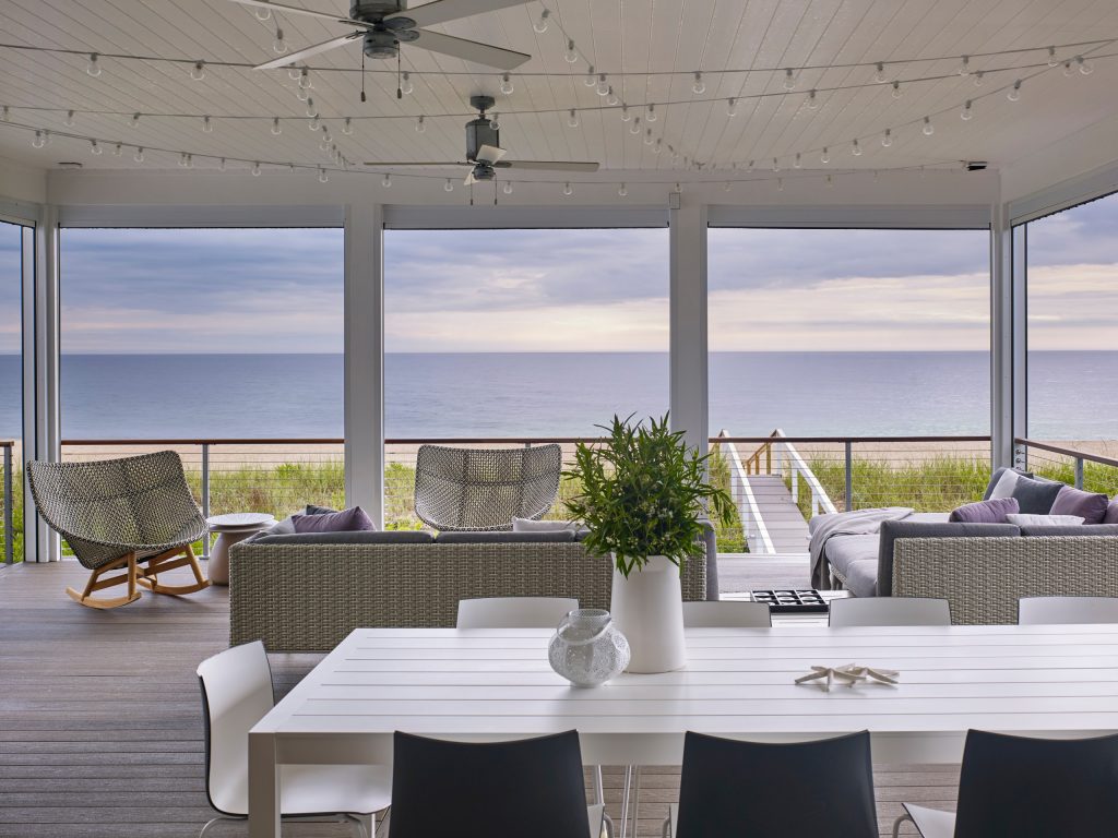 This is an example of a large coastal screened-in back porch design in Other with decking and a roof extension. by Scott Edmonston Architecture Studio | Outdoor Photos | Porch | Landscaping | Landscape Design | Outdoor Living Space | Porch Design Ideas | Outdoor Living Space Ideas | Backyard Design