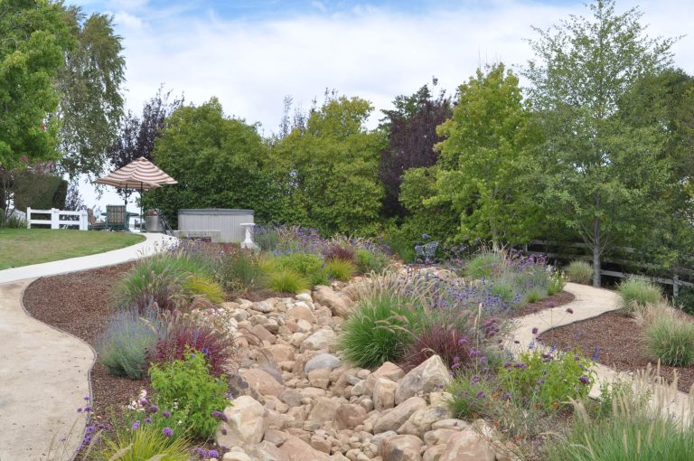 This is an example of a large contemporary drought-tolerant and full sun backyard stone garden path in Santa Barbara.