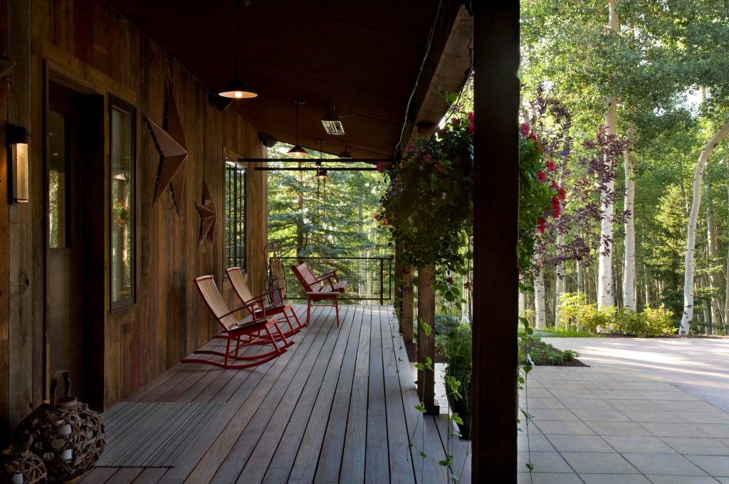 This is an example of a large contemporary front porch design in Denver with decking and a roof extension. by Sefra Maples Interior Design and Consulting | Outdoor Photos | Porch | Landscaping | Landscape Design | Outdoor Living Space | Porch Design Ideas | Outdoor Living Space Ideas | Backyard Design