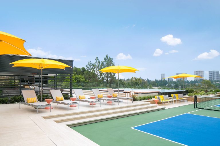This is an example of a large contemporary full sun backyard outdoor sport court in Orange County.