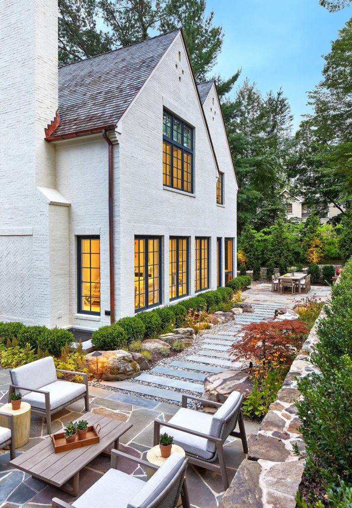 This is an example of a large contemporary full sun backyard stone walkway in DC Metro for summer.
