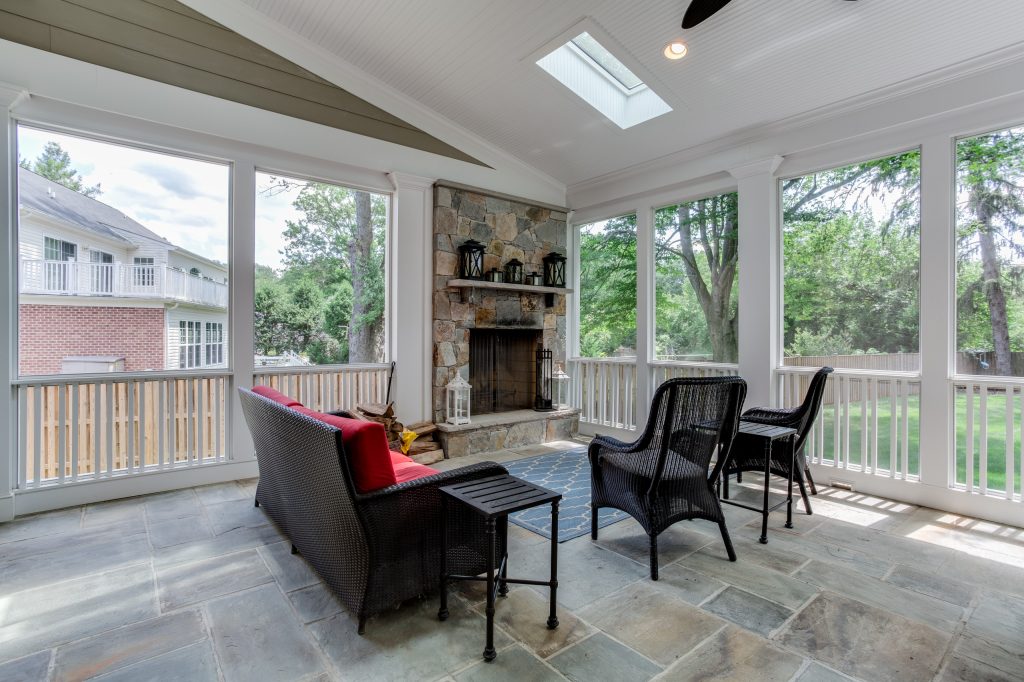 This is an example of a large cottage stone back porch design in DC Metro with a fire pit and a roof extension. by Claude C. Lapp Architects, LLC | Outdoor Photos | Porch | Landscaping | Landscape Design | Outdoor Living Space | Porch Design Ideas | Outdoor Living Space Ideas | Backyard Design