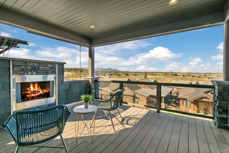This is an example of a large craftsman side porch design in Portland with a fireplace, decking and a roof extension. by Curtis Homes | Outdoor Photos | Porch | Landscaping | Landscape Design | Outdoor Living Space | Porch Design Ideas | Outdoor Living Space Ideas | Backyard Design