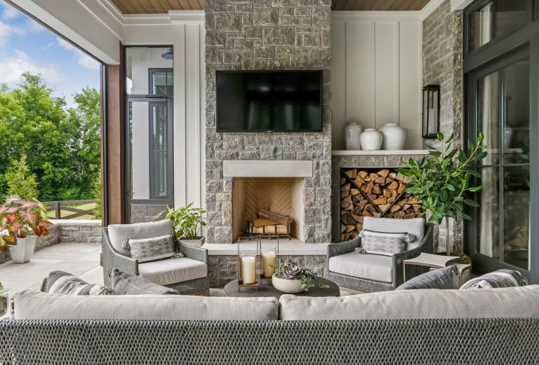 This is an example of a large farmhouse stone screened-in back porch design in Nashville with a roof extension. by Brad Ramsey Interiors | Outdoor Photos | Porch | Landscaping | Landscape Design | Outdoor Living Space | Porch Design Ideas | Outdoor Living Space Ideas | Backyard Design