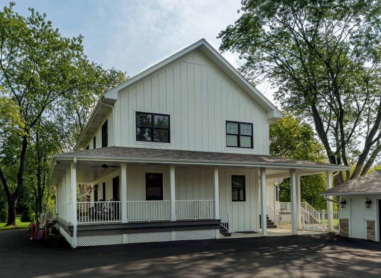 This is an example of a large farmhouse wood railing porch design in Chicago with decking and a roof extension. by 12/12 Architects & Planners | Outdoor Photos | Porch | Landscaping | Landscape Design | Outdoor Living Space | Porch Design Ideas | Outdoor Living Space Ideas | Backyard Design