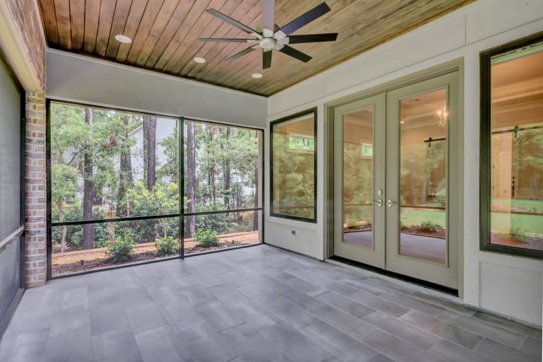 This is an example of a large french country tile screened-in back porch design in Houston with a roof extension. by Wyrick Residential Design | Outdoor Photos | Porch | Landscaping | Landscape Design | Outdoor Living Space | Porch Design Ideas | Outdoor Living Space Ideas | Backyard Design