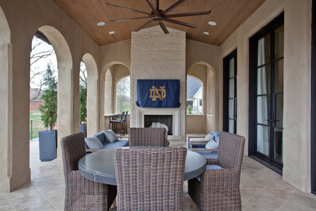 This is an example of a large mediterranean stone back porch design in Other with a fireplace and a roof extension. by Fairchild Construction | Outdoor Photos | Porch | Landscaping | Landscape Design | Outdoor Living Space | Porch Design Ideas | Outdoor Living Space Ideas | Backyard Design