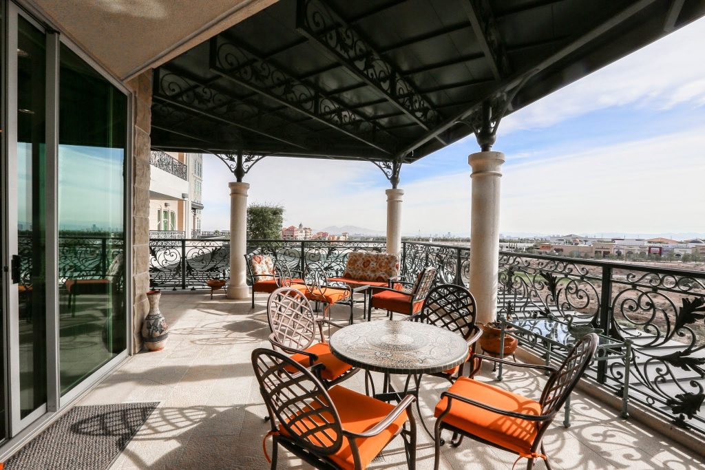 This is an example of a large porch design in Las Vegas with an awning. by One Queensridge Place | Outdoor Photos | Porch | Landscaping | Landscape Design | Outdoor Living Space | Porch Design Ideas | Outdoor Living Space Ideas | Backyard Design