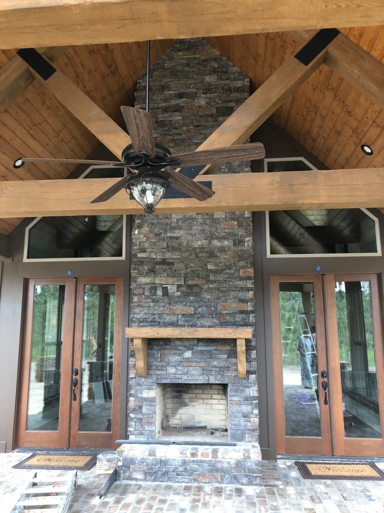 This is an example of a large rustic brick back porch design in Other with a roof extension and a fireplace. by Richard J. Moudy Construction LLC | Outdoor Photos | Porch | Landscaping | Landscape Design | Outdoor Living Space | Porch Design Ideas | Outdoor Living Space Ideas | Backyard Design