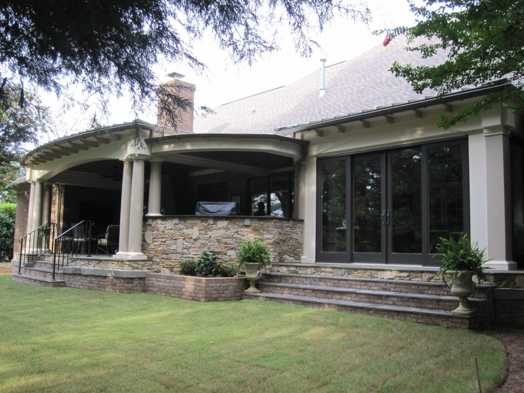 This is an example of a large rustic tile porch design in Other with a roof extension. by B.E.Womick General Contractor, LLC | Outdoor Photos | Porch | Landscaping | Landscape Design | Outdoor Living Space | Porch Design Ideas | Outdoor Living Space Ideas | Backyard Design