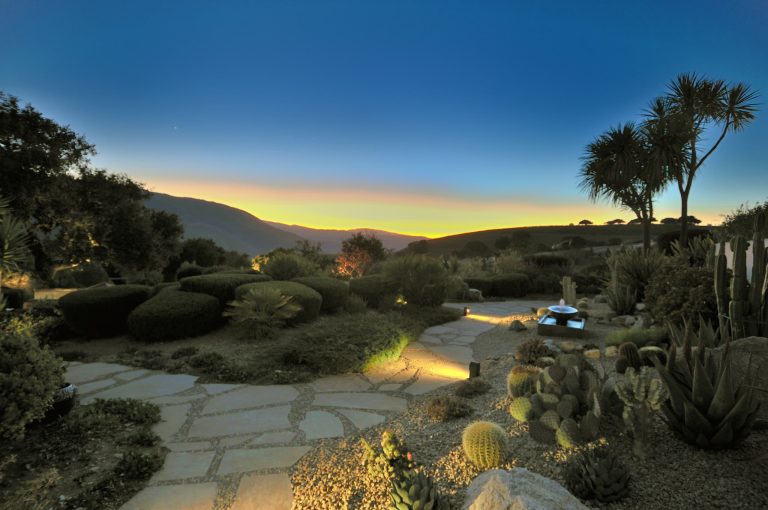 This is an example of a large southwestern full sun and desert backyard stone formal garden in Other.