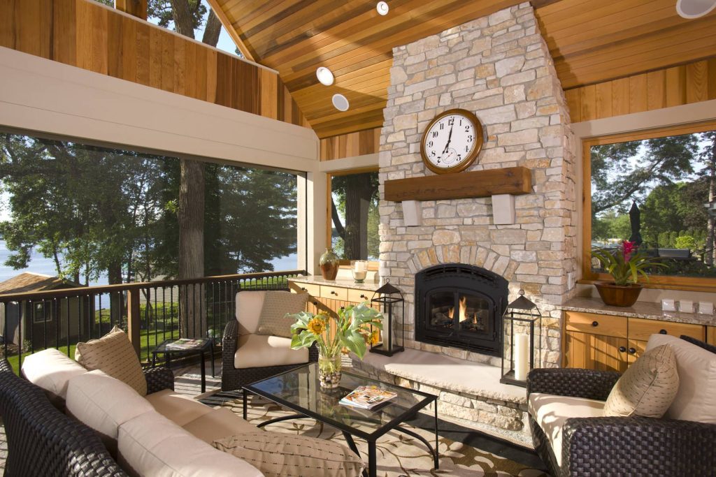 This is an example of a large traditional back porch design in Minneapolis with a fire pit and a roof extension. by Alexander Design Group, Inc. | Outdoor Photos | Porch | Landscaping | Landscape Design | Outdoor Living Space | Porch Design Ideas | Outdoor Living Space Ideas | Backyard Design