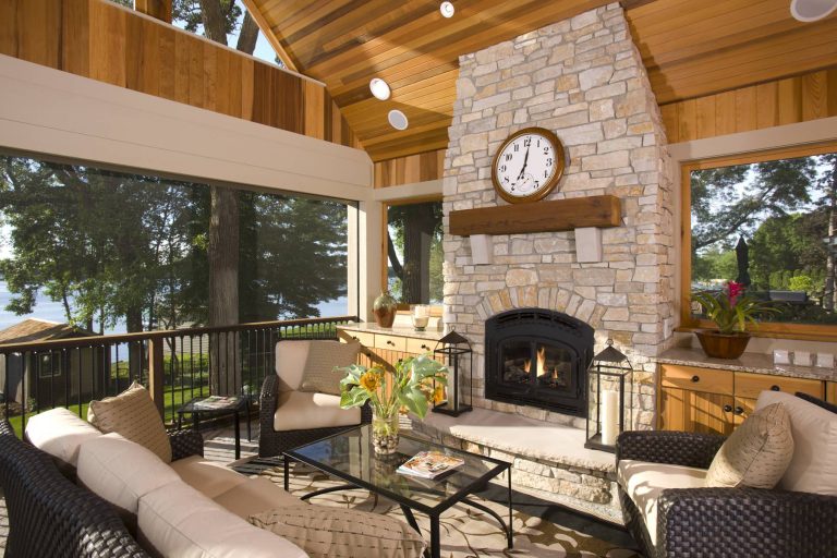 This is an example of a large traditional back porch design in Minneapolis with a fire pit and a roof extension. by Alexander Design Group, Inc. | Outdoor Photos | Porch | Landscaping | Landscape Design | Outdoor Living Space | Porch Design Ideas | Outdoor Living Space Ideas | Backyard Design