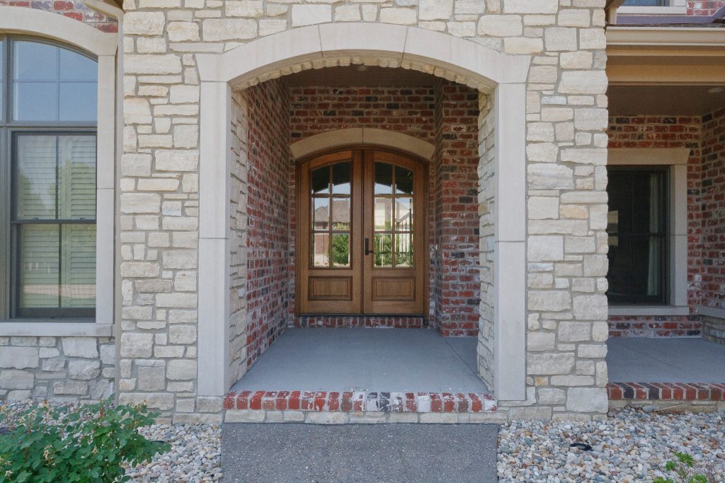 This is an example of a large traditional concrete front porch design in St Louis with a roof extension. by Premier Homes by Jones | Outdoor Photos | Porch | Landscaping | Landscape Design | Outdoor Living Space | Porch Design Ideas | Outdoor Living Space Ideas | Backyard Design