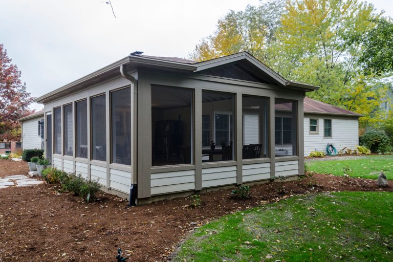 This is an example of a large traditional concrete screened-in back porch design in Chicago with a roof extension. by Synergy Builders Inc. | Outdoor Photos | Porch | Landscaping | Landscape Design | Outdoor Living Space | Porch Design Ideas | Outdoor Living Space Ideas | Backyard Design