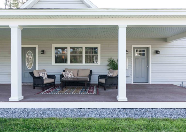 This is an example of a large traditional front porch design in Portland Maine with a roof extension and decking. by | Outdoor Photos | Porch | Landscaping | Landscape Design | Outdoor Living Space | Porch Design Ideas | Outdoor Living Space Ideas | Backyard Design