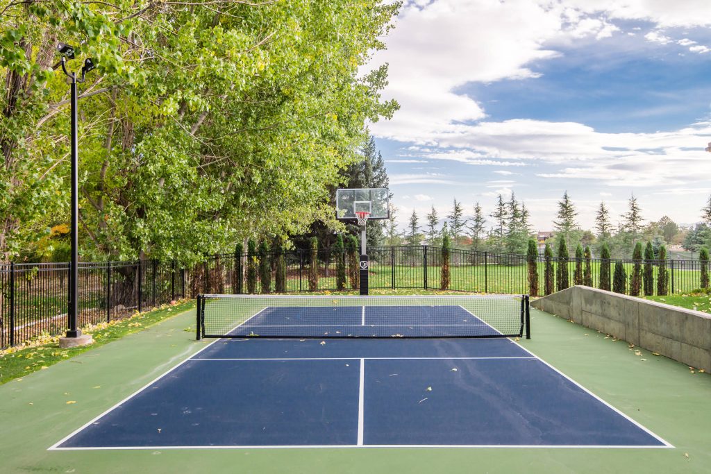 This is an example of a large traditional full sun backyard metal fence outdoor sport court in Salt Lake City for summer.