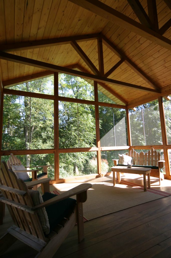 This is an example of a large traditional screened-in back porch design in Detroit with decking and a roof extension. by PLUM design / build | Outdoor Photos | Porch | Landscaping | Landscape Design | Outdoor Living Space | Porch Design Ideas | Outdoor Living Space Ideas | Backyard Design