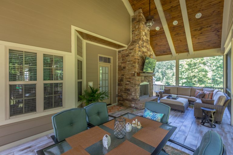 This is an example of a large traditional screened-in back porch design in Other with a roof extension and decking. by Chattanooga eXteriors | Outdoor Photos | Porch | Landscaping | Landscape Design | Outdoor Living Space | Porch Design Ideas | Outdoor Living Space Ideas | Backyard Design