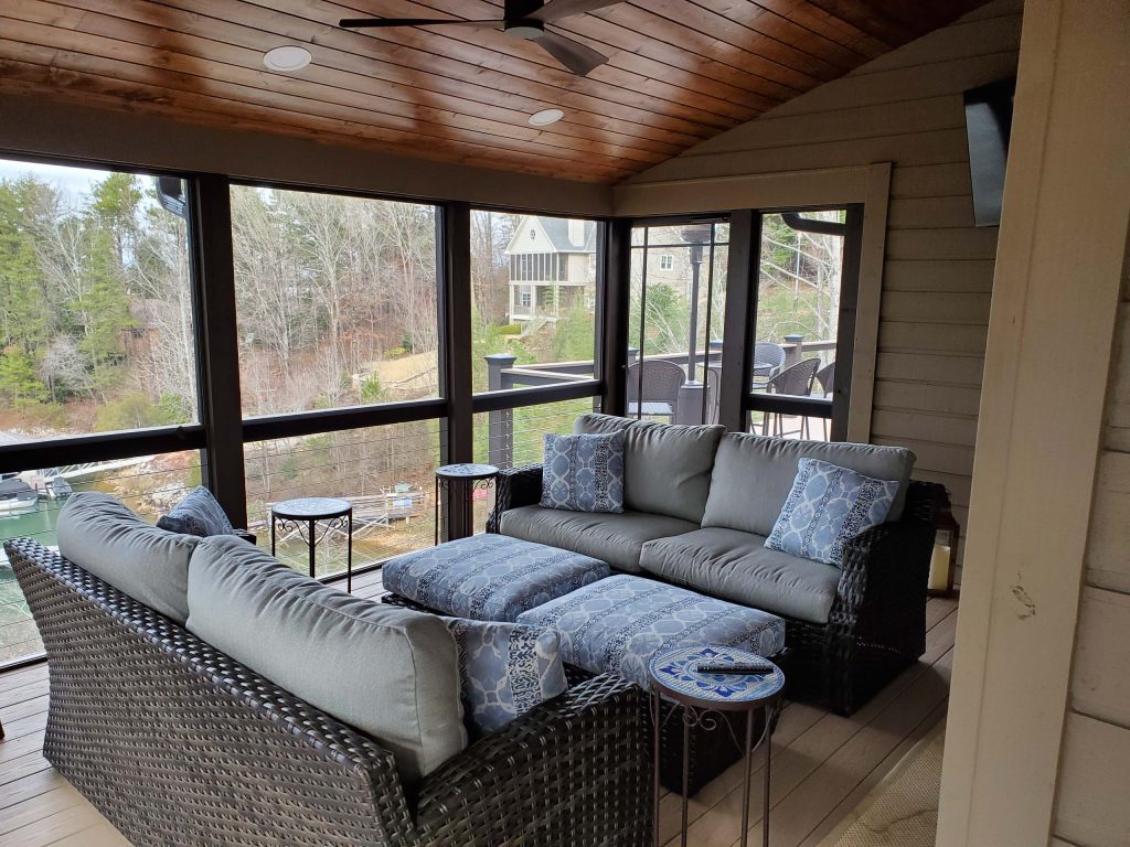 This is an example of a large traditional screened-in back porch design in Other with decking and a roof extension. by The Idea Company | Outdoor Photos | Porch | Landscaping | Landscape Design | Outdoor Living Space | Porch Design Ideas | Outdoor Living Space Ideas | Backyard Design