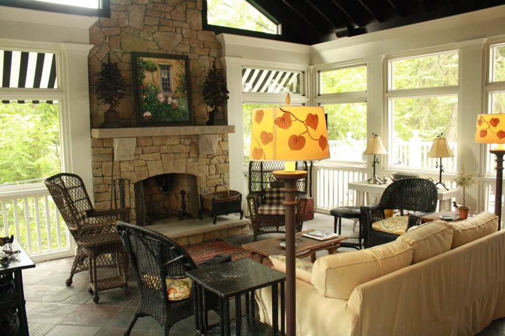 This is an example of a large traditional tile back porch design in Louisville with a roof extension. by Stonehenge Construction LLC | Outdoor Photos | Porch | Landscaping | Landscape Design | Outdoor Living Space | Porch Design Ideas | Outdoor Living Space Ideas | Backyard Design